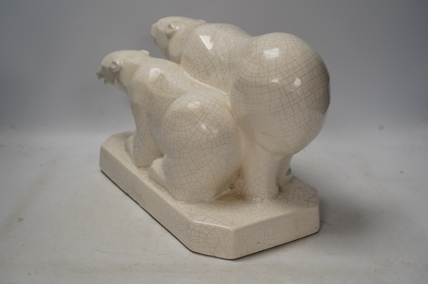 An Art Deco polar bear figure group, 34cm long. Condition - heavily crazed but good